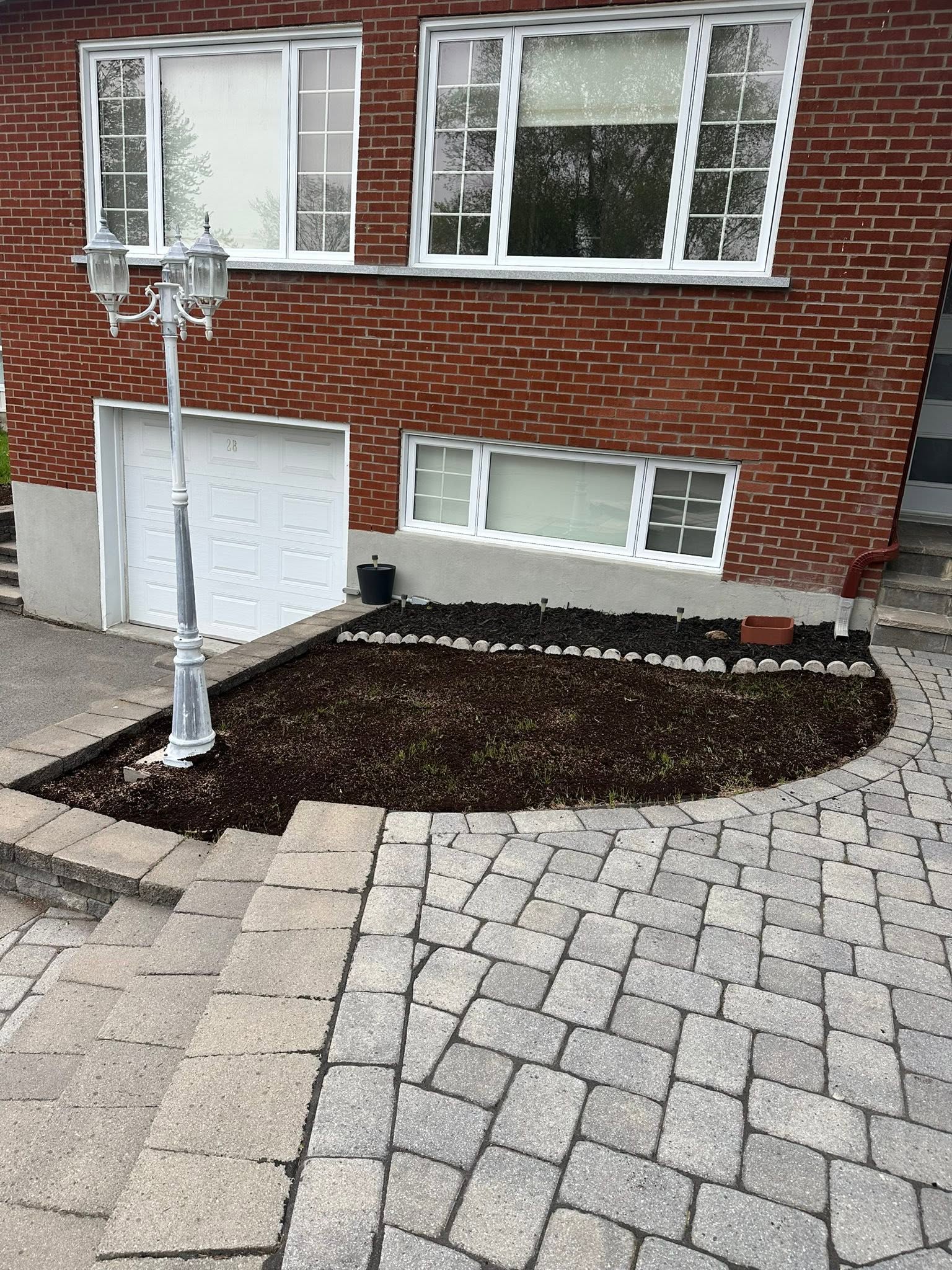 Stone pavers and garden bed prepared for finishing